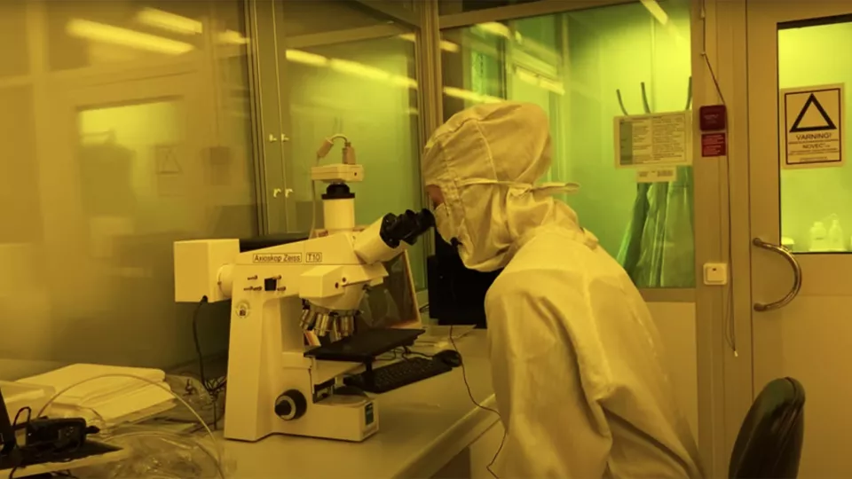 Photo of a person in the clean room nanolab.