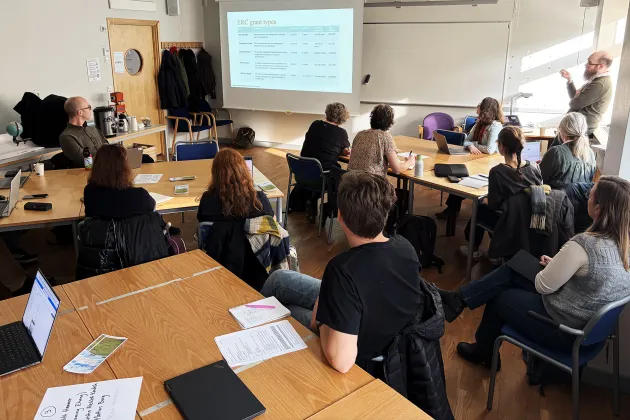 People in a room. Photo.