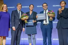 Photo of five people during an award ceremony