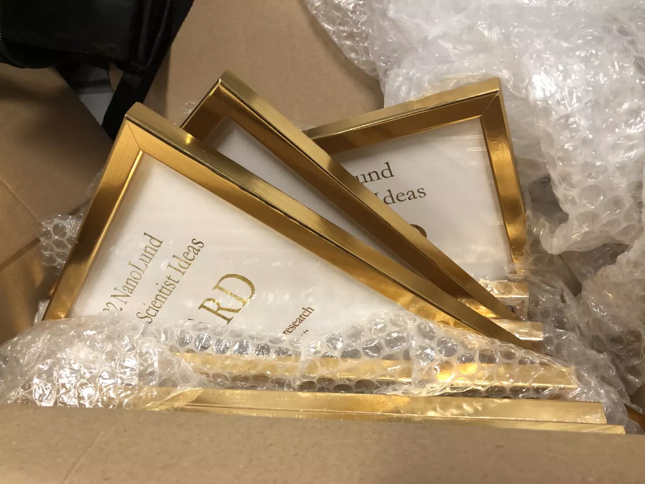 Photo of diplomas in a box.