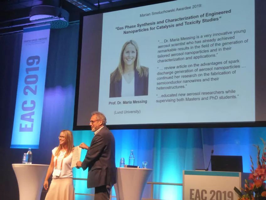 Photo of Maria Messing receiving the Smoluchowski Award at the EAC Conference 2019
